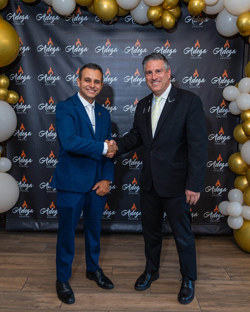 Elthon with mayor at brazilian steakhouse in kissimmee